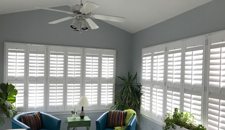 Jacksonville living room with fan and shutters